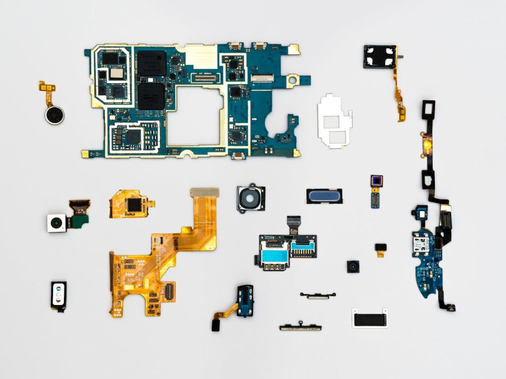 pexels-photo-1476321 Exploded view of smartphone components showcasing intricate technological design.